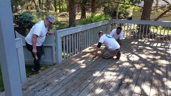 JP Custom Painting workers staining deck
